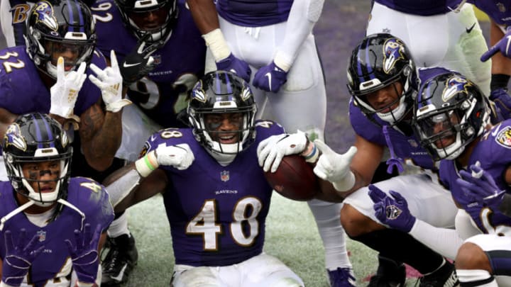 BALTIMORE, MARYLAND - OCTOBER 11: Inside linebacker Patrick Queen #48 of the Baltimore Ravens celebrates after returning a fumble for a fourth quarter touchdown against the Cincinnati Bengals at M&T Bank Stadium on October 11, 2020 in Baltimore, Maryland. (Photo by Rob Carr/Getty Images)