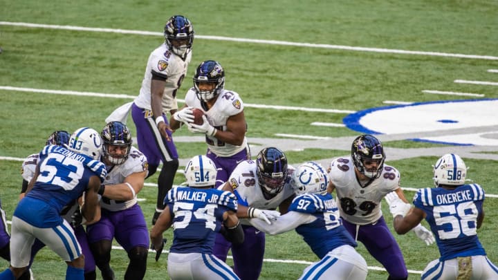 Nov 8, 2020; Indianapolis, Indiana, USA; Baltimore Ravens running back J.K. Dobbins (27) runs the ball against the Indianapolis Colts in the second half at Lucas Oil Stadium. Mandatory Credit: Trevor Ruszkowski-USA TODAY Sports