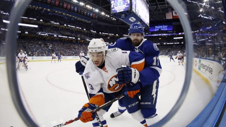 Apr 27, 2016; Tampa, FL, USA; New York Islanders defenseman Travis Hamonic (3) and Tampa Bay Lightning center Alex Killorn (17) fight to control the puck on the boards during the first period in game one of the second round of the 2016 Stanley Cup Playoffs at Amalie Arena. Mandatory Credit: Kim Klement-USA TODAY Sports Apr 27, 2016; Tampa, FL, USA; New York Islanders defenseman Travis Hamonic (3) and Tampa Bay Lightning center Alex Killorn (17) fight to control the puck on the boards during the first period in game one of the second round of the 2016 Stanley Cup Playoffs at Amalie Arena. Mandatory Credit: Kim Klement-USA TODAY Sports