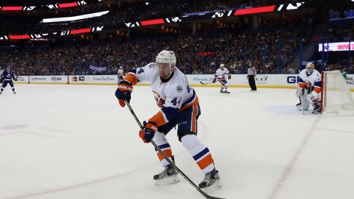 Mar 25, 2016; Tampa, FL, USA; New York Islanders defenseman Calvin de Haan (44) passes the puck against the Tampa Bay Lightning during the second period at Amalie Arena. Mandatory Credit: Kim Klement-USA TODAY Sports Mar 25, 2016; Tampa, FL, USA; New York Islanders defenseman Calvin de Haan (44) passes the puck against the Tampa Bay Lightning during the second period at Amalie Arena. Mandatory Credit: Kim Klement-USA TODAY Sports