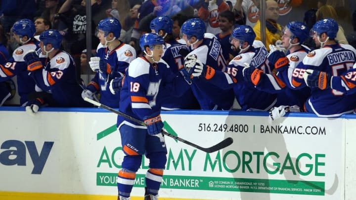 Jan 27, 2015; Uniondale, NY, USA; New York Islanders center Ryan Strome (18) celebrates his goal against the New York Rangers with teammates during the third period at Nassau Veterans Memorial Coliseum. The Islanders defeated the Rangers 4-1. Mandatory Credit: Brad Penner-USA TODAY Sports