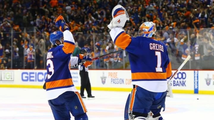 Apr 24, 2016; Brooklyn, NY, USA; New York Islanders center Casey Cizikas (53) congratulates winning goaltender Thomas Greiss (1) after the Islanders defeated the Panthers in game six of the first round of the 2016 Stanley Cup Playoffs at Barclays Center. The Islanders defeated the Panthers 2-1 to win the series four games to two. Mandatory Credit: Andy Marlin-USA TODAY Sports