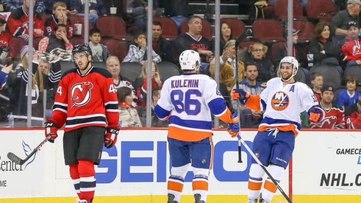 Oct 31, 2015; Newark, NJ, USA; New York Islanders center Frans Nielsen (51) and left wing Nikolay Kulemin (86) celebrate his goal during the second period in the NHL game against the New Jersey Devils at Prudential Center. Mandatory Credit: Vincent Carchietta-USA TODAY Sports