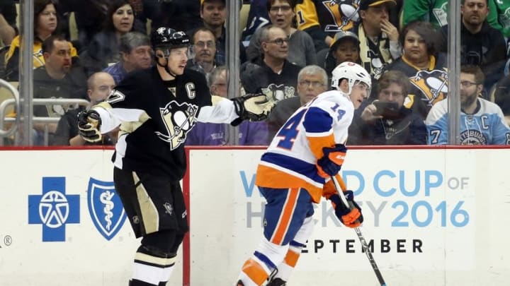 Mar 15, 2016; Pittsburgh, PA, USA; Pittsburgh Penguins center Sidney Crosby (87) reacts after his stick was broken by New York Islanders defenseman Thomas Hickey (14) during the third period at the CONSOL Energy Center. The Penguins won 2-1 in a shootout. Mandatory Credit: Charles LeClaire-USA TODAY Sports