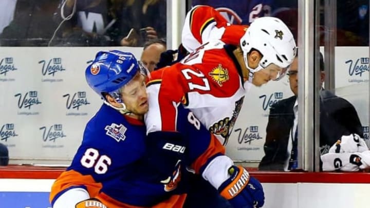Apr 20, 2016; Brooklyn, NY, USA; New York Islanders left wing Nikolay Kulemin (86) checks Florida Panthers center Nick Bjugstad (27) during the first period of game four of the first round of the 2016 Stanley Cup Playoffs against the Florida Panthers at Barclays Center. Mandatory Credit: Andy MarlinIslandersUSA TODAY Sports
