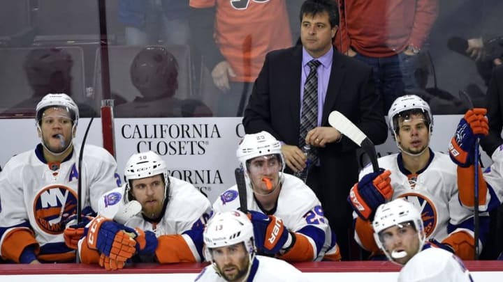 Apr 7, 2015; Philadelphia, PA, USA; New York Islanders head coach Jack Capuano stands behind his team on the bench after the Philadelphia Flyers scored the game-winning goal with three seconds left during the third period at Wells Fargo Center. The Flyers defeated the Islanders, 5-4. Mandatory Credit: Eric Hartline-USA TODAY Sports