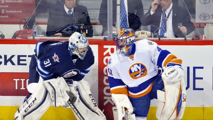 Mar 3, 2016; Winnipeg, Manitoba, CAN; New York Islanders goalie Jaroslav Halak (41) talks with Winnipeg Jets goalie Ondrej Pavelec (31) prior to the game against the Winnipeg Jets at MTS Centre. Mandatory Credit: Bruce Fedyck-USA TODAY Sports
