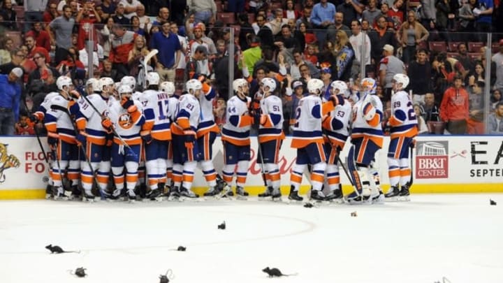 Apr 22, 2016; Sunrise, FL, USA; The New York Islanders celebrate their double overtime goal in game five of the first round of the 2016 Stanley Cup Playoffs against the Florida Panthers at BB&T Center. Mandatory Credit: Robert Duyos-USA TODAY Sports