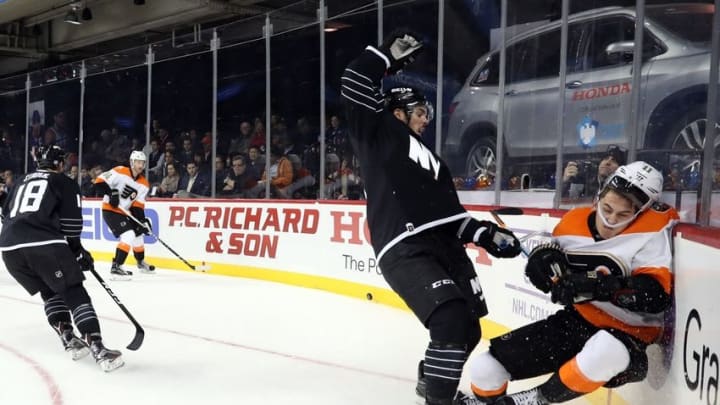 Nov 3, 2016; Brooklyn, NY, USA; New York Islanders defenseman Travis Hamonic (3) checks Philadelphia Flyers center Travis Konecny (11) during the third period at Barclays Center. Philadelphia Flyers won 3-2 in shootout. Mandatory Credit: Anthony Gruppuso-USA TODAY Sports