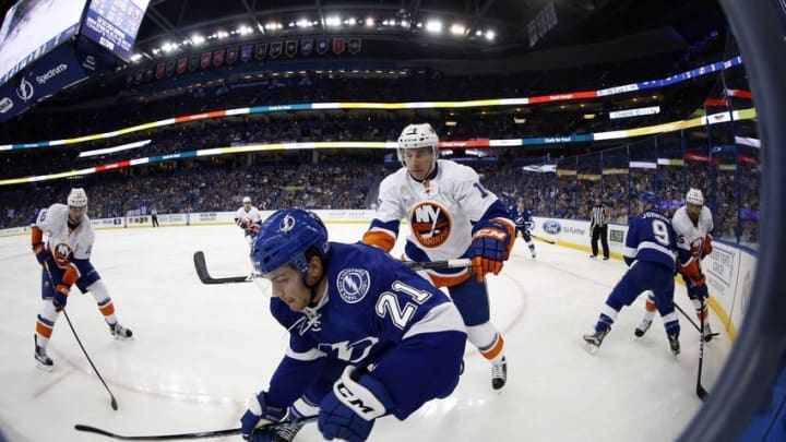 Nov 10, 2016; Tampa, FL, USA; New York Islanders right wing Ryan Strome (18) defends Tampa Bay Lightning center Brayden Point (21) into the boards as they fight to control the puck during the second period at Amalie Arena. Mandatory Credit: Kim Klement-USA TODAY Sports