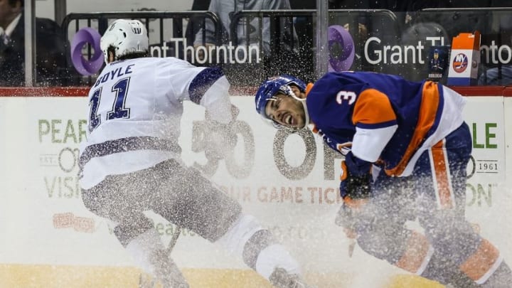 Nov 14, 2016; Brooklyn, NY, USA; New York Islanders defenseman Travis Hamonic (3) reacts as Tampa Bay Lightning center Brian Boyle (11) changes direction during the first period at Barclays Center. Mandatory Credit: Vincent Carchietta-USA TODAY Sports