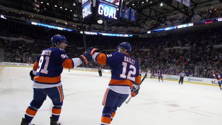 Jan 29, 2015; Uniondale, NY, USA; New York Islanders center John Tavares (91) celebrates his goal against the Boston Bruins with New York Islanders left wing Josh Bailey (12) during the second period at Nassau Veterans Memorial Coliseum. Mandatory Credit: Brad Penner-USA TODAY Sports