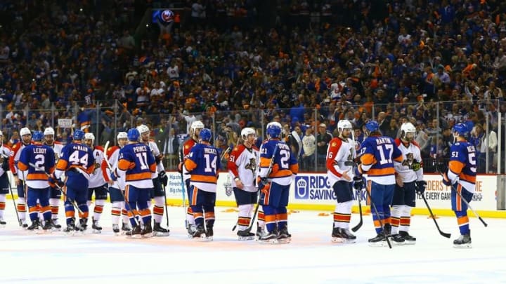 Apr 24, 2016; Brooklyn, NY, USA; The New York Islanders are congratulated by the the Florida Panthers during the ceremonial handshake line after defeating the Panthers in double overtime in game six of the first round of the 2016 Stanley Cup Playoffs at Barclays Center. The Islanders defeated the Panthers 2-1 to win the series four games to two. Mandatory Credit: Andy Marlin-USA TODAY Sports