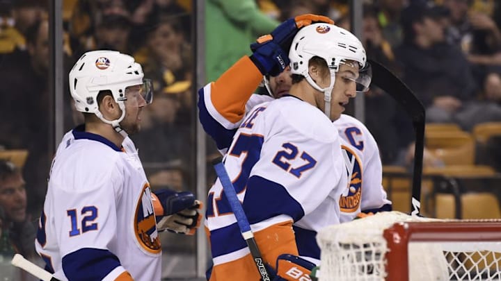 Dec 20, 2016; Boston, MA, USA; New York Islanders left wing Anders Lee (27) is congratulated by left wing Josh Bailey (12) and center John Tavares (91) after scoring a goal during the first period against the Boston Bruins at TD Garden. Mandatory Credit: Bob DeChiara-USA TODAY Sports