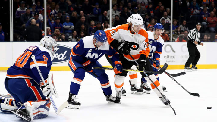 UNIONDALE, NEW YORK – MARCH 03: Robin Lehner #40 of the New York Islanders defends the net against Oskar Lindblom #23 of the Philadelphia Flyers during their game at NYCB Live’s Nassau Coliseum on March 03, 2019 in Uniondale, New York. (Photo by Al Bello/Getty Images)