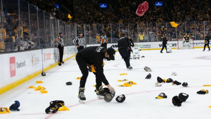 BOSTON, MA MAY 29: Hats rain down after David Pastrnak #88 of the Boston Bruins (not pictured) scores his third goal of the game during the third period against the New York Islanders in Game One of the Second Round of the 2021 Stanley Cup Playoffs at the TD Garden on May 29, 2021 in Boston, Massachusetts. (Photo by Rich Gagnon/Getty Images)