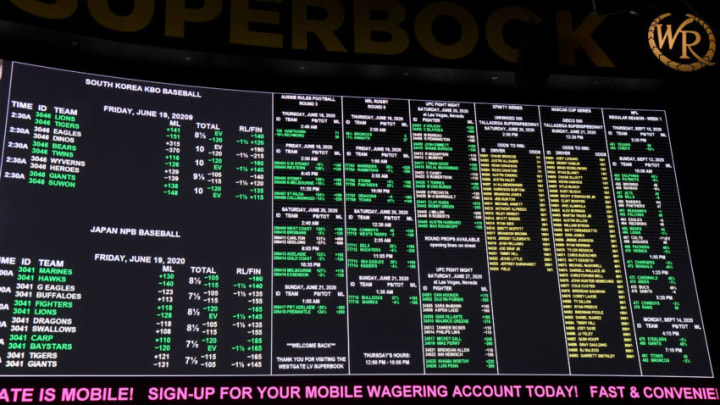 LAS VEGAS, NEVADA - JUNE 18: Betting lines are displayed at the Race & Sports SuperBook at the Westgate Las Vegas Resort & Casino, which features new screens on its entire 240-by-20 foot, 4,488-square-foot HD video layout, after the property opened for the first time since being closed in mid-March because of the coronavirus (COVID-19) pandemic on June 18, 2020 in Las Vegas, Nevada. Hotel-casinos throughout the state were allowed to open on June 4 as part of a phased reopening of the economy with social distancing guidelines and other restrictions in place. The Westgate, which first opened as the International in 1969, had planned to reopen with designated non-smoking, mask-required table games over half of its casino floor, as well as designated mask-required elevators. On Wednesday, citing updated guidance from the Centers for Disease Control and Prevention, the Nevada Gaming Control Board issued an industry notice updating its health and safety policy. It dictates that all players at table and card games must wear face coverings if there is no barrier between the dealer and each player. The policy applies to spectators or anyone else within six feet of a game. Also, properties must offer face masks or cloth coverings to guests as they enter the casino or have dedicated signage alerting patrons that they are available. (Photo by Ethan Miller/Getty Images)