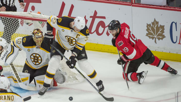 Apr 15, 2017; Ottawa, Ontario, CAN; Boston Bruins defenseman Zdeno Chara (33) clears the puck following a save from goalie Tuuka Rask (40) on a shot from Ottawa Senators center Derick Brassard (19) in the third period of game two of the first round of the 2017 Stanley Cup Playoffs at Canadian Tire Centre. Mandatory Credit: Marc DesRosiers-USA TODAY Sports