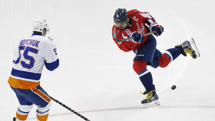 Apr 23, 2015; Washington, DC, USA; Washington Capitals left wing Alex Ovechkin (8) has a shot blocked by New York Islanders defenseman Johnny Boychuk (55) in the third period in game five of the first round of the 2015 Stanley Cup Playoffs at Verizon Center. The Capitals won 5-1. Mandatory Credit: Geoff Burke-USA TODAY Sports