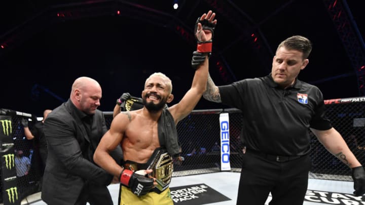 July 19, 2020; Abu Dhabi, UAE; Deiveson Figueiredo of Brazil celebrates after defeating Joseph Benavidez in their UFC flyweight championship bout during UFC Fight Night at the Flash Forum on UFC Fight Island. Mandatory Credit: Jeff Bottari/Zuffa LLC via USA TODAY Sports