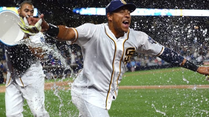 May 21, 2016; San Diego, CA, USA; San Diego Padres third baseman Yangervis Solarte (26) reacts to being doused with water by right fielder Matt Kemp (left) after an eleventh inning walk off walk victory against the Los Angeles Dodgers at Petco Park. Mandatory Credit: Jake Roth-USA TODAY Sports