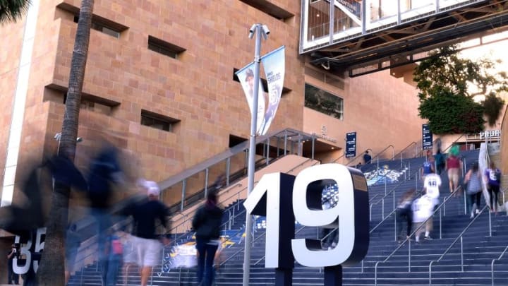 Apr 22, 2016; San Diego, CA, USA; Fans enter Petco Park near the retired number of the late San Diego Padres former player Tony Gwynn before the game against the St. Louis Cardinals. Mandatory Credit: Jake Roth-USA TODAY Sports