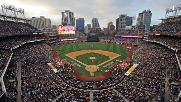 Mike Piazza of the San Diego Padres looks on as he stands outside the