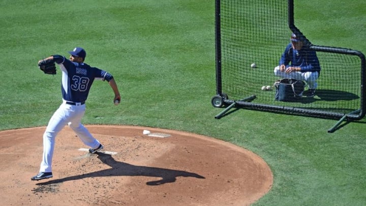 Aug 20, 2016; San Diego, CA, USA; San Diego Padres starting pitcher Tyson Ross (38) throws live batting practice as pitching coach Darren Balsley (36) watches before the game against the Arizona Diamondbacks at Petco Park. Mandatory Credit: Jake Roth-USA TODAY Sports