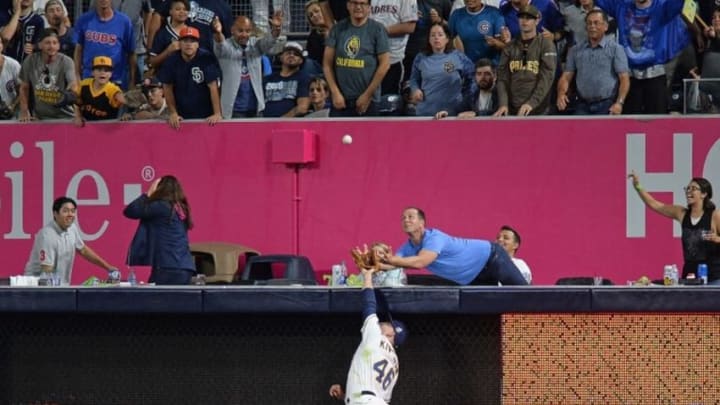 Aug 22, 2016; San Diego, CA, USA; San Diego Padres left fielder Patrick Kivlehan (46) and a fan ready to try and catch a two run home run by Chicago Cubs right fielder Jason Heyward (not pictured) during the fifth inning at Petco Park. Mandatory Credit: Jake Roth-USA TODAY Sports