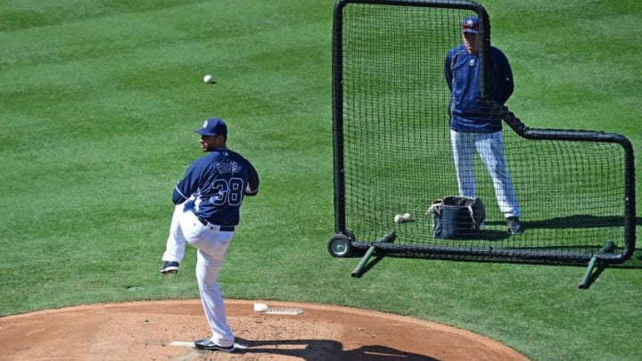 Aug 20, 2016; San Diego, CA, USA; San Diego Padres starting pitcher Tyson Ross (38) throws live batting practice as pitching coach Darren Balsley (36) watches before the game against the Arizona Diamondbacks at Petco Park. Mandatory Credit: Jake Roth-USA TODAY Sports