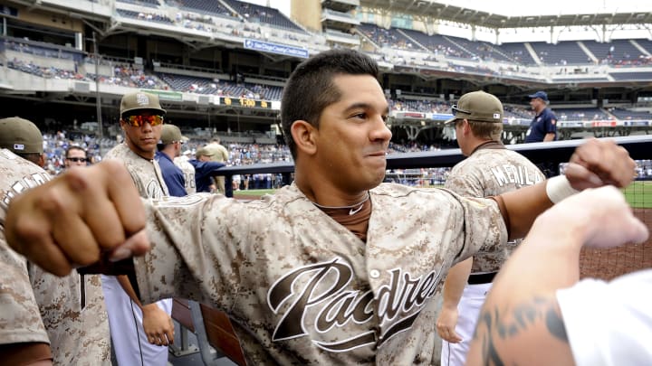 Alberto Gonzalez #14 flexes. (Photo by Andy Hayt/San Diego Padres/Getty Images)