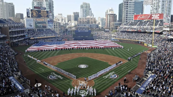 SAN DIEGO, CA - APRIL 5 : U.S. Navy sailors roll out a huge American flag before the Padres home opener between the Los Angeles Dodgers and the San Diego Padres at Petco Park on April 5, 2012 in San Diego, California. (Photo by Denis Poroy/Getty Images)