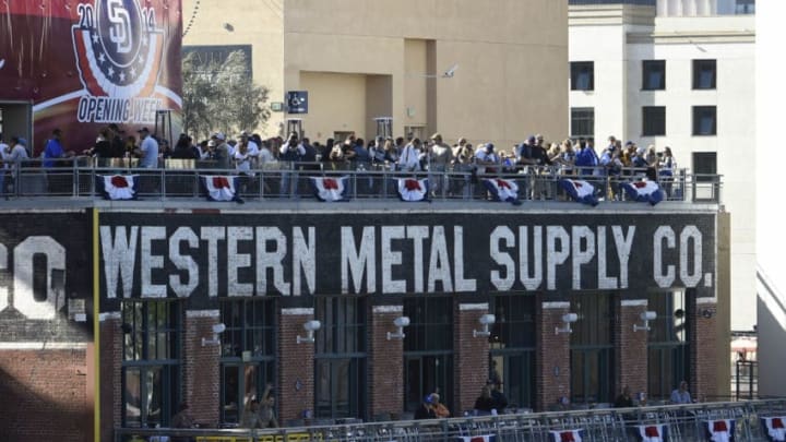 SAN DIEGO, CA - MARCH 30: Fans enjoy the game from atop the Western Metal Supply building on Opening Night before a baseball game between the Los Angeles Dodgers and the San Diego Padres at Petco Park on March 30, 2014 in San Diego, California. (Photo by Denis Poroy/Getty Images)