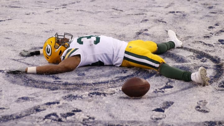 EAST RUTHERFORD, NEW JERSEY - DECEMBER 01: Aaron Jones #33 of the Green Bay Packers makes a snow angel in the end zone in the fourth quarter against the New York Giants at MetLife Stadium on December 01, 2019 in East Rutherford, New Jersey.The touchdown was called back on penalties.The Green Bay Packers defeated the New York Giants 31-13. (Photo by Elsa/Getty Images)