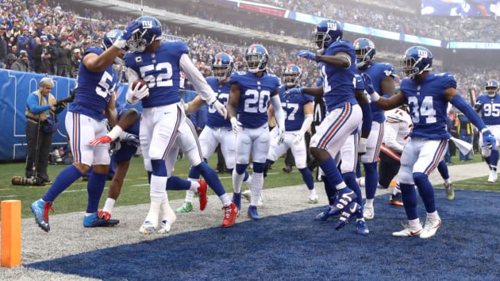 EAST RUTHERFORD, NEW JERSEY - DECEMBER 02: Alec Ogletree #52 of the New York Giants is congratulated by his teammates after intercepting the ball for a first-quarter touchdown against the Chicago Bears at MetLife Stadium on December 02, 2018 in East Rutherford, New Jersey. (Photo by Al Bello/Getty Images)