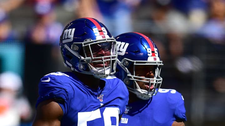 EAST RUTHERFORD, NEW JERSEY - SEPTEMBER 15: Lorenzo Carter #59 of the New York Giants and B.J. Hill #95 of the New York Giants celebrate during their game against the Buffalo Bills at MetLife Stadium on September 15, 2019 in East Rutherford, New Jersey. (Photo by Emilee Chinn/Getty Images)