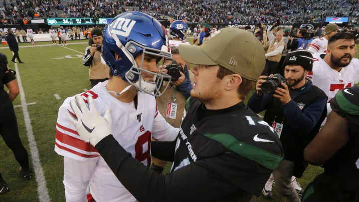 EAST RUTHERFORD, NEW JERSEY – NOVEMBER 10: (NEW YORK DAILIES OUT) Daniel Jones #8 of the New York Giants and Sam Darnold #14 of the New York Jets meet after their game at MetLife Stadium on November 10, 2019 in East Rutherford, New Jersey. The Jets defeated the Giants 34-27. (Photo by Jim McIsaac/Getty Images)