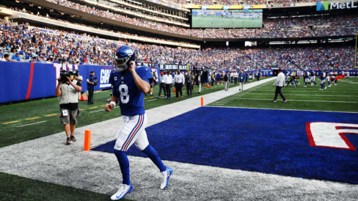 EAST RUTHERFORD, NEW JERSEY - SEPTEMBER 12: Daniel Jones #8 of the New York Giants runs off the field at halftime against the Denver Broncos at MetLife Stadium on September 12, 2021 in East Rutherford, New Jersey. (Photo by Tim Nwachukwu/Getty Images)