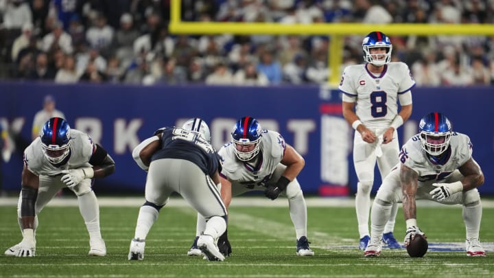 EAST RUTHERFORD, NJ – SEPTEMBER 26: Jon Feliciano #76 of the New York Giants gets set next to Mark Glowinski #64 and Evan Neal #73 against the Dallas Cowboys at MetLife Stadium on September 26, 2022 in East Rutherford, New Jersey. (Photo by Cooper Neill/Getty Images)