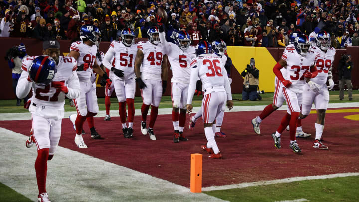 LANDOVER, MARYLAND – DECEMBER 18: Kayvon Thibodeaux #5 of the New York Giants celebrates after returning a fumble for a touchdown during the second quarter against the Washington Commanders at FedExField on December 18, 2022 in Landover, Maryland. (Photo by Rob Carr/Getty Images)