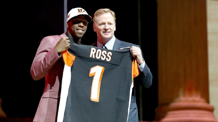 John Ross of Washington poses with Commissioner of the National Football League Roger Goodell  (Photo by Elsa/Getty Images)