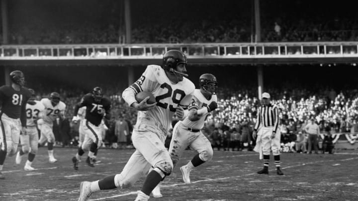NEW YORK – DECEMBER 30: Runningback Alex Webster #29, of the New York Giants, runs for a large gain after catching a pass from quarterback Charlie Conerly #42 during the NFL Championship Game on December 30, 1956 at Yankee Stadium in New York, New York. The Giants beat the Bears, 47-7. (Photo by: Kidwiler Collection/Diamond Images/Getty Images)