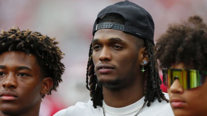 NORMAN, OK - APRIL 23: Wide receiver CeeDee Lamb, a former player for the Oklahoma Sooners, greets young prospects during the spring game at Gaylord Family Oklahoma Memorial Stadium on April 23, 2022 in Norman, Oklahoma. (Photo by Brian Bahr/Getty Images)