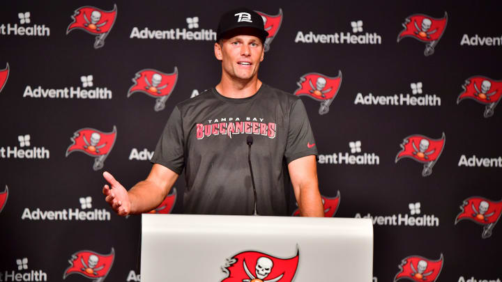 TAMPA, FLORIDA – JUNE 09: Tom Brady #12 of Tampa Bay Buccaneers answers questions at a press conference following the 2022 Buccaneers minicamp at AdventHealth Training Center on June 09, 2022 in Tampa, Florida. (Photo by Julio Aguilar/Getty Images)