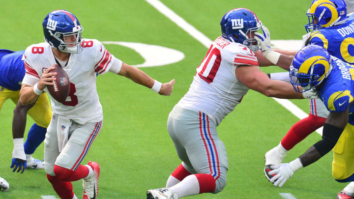 Oct 4, 2020; Inglewood, California, USA; New York Giants quarterback Daniel Jones (8) moves out as offensive guard Kevin Zeitler (70) blocks against the Los Angeles Rams during the second half at SoFi Stadium. Mandatory Credit: Gary A. Vasquez-USA TODAY Sports