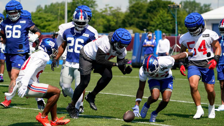 New York Giants cornerback Adoree’ Jackson (22) picks up the ball after a fumble by the offense on the first day of training camp at Quest Diagnostics Training Center in East Rutherford on Wednesday, July 27, 2022.Nfl Giants Training Camp