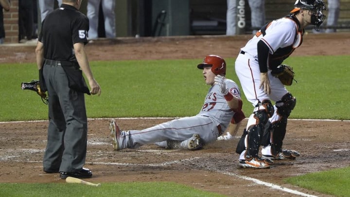 Jul 8, 2016; Baltimore, MD, USA; Los Angeles Angels center fielder Mike Trout (27) scores doing the sixth inning against the Baltimore Orioles at Oriole Park at Camden Yards. Los Angeles Angels defeated Baltimore Orioles 9-5. Mandatory Credit: Tommy Gilligan-USA TODAY Sports