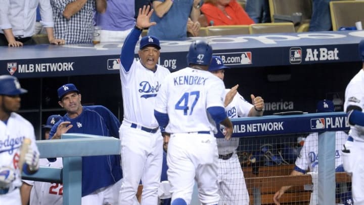 Oct 20, 2016; Los Angeles, CA, USA; Los Angeles Dodgers left fielder Howie Kendrick (47) celebrates with teammates after scoring a run in the fourth inning against the Chicago Cubs in game five of the 2016 NLCS playoff baseball series against the Los Angeles Dodgers at Dodger Stadium. Mandatory Credit: Gary A. Vasquez-USA TODAY Sports