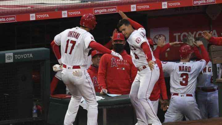 May 17, 2021; Anaheim, California, USA; Los Angeles Angels designated hitter Shohei Ohtani (17) is congratulated by shortstop Jose Iglesias (4) after hitting a two-run home run against the Cleveland Indians during the second inning at Angel Stadium. Mandatory Credit: Richard Mackson-USA TODAY Sports