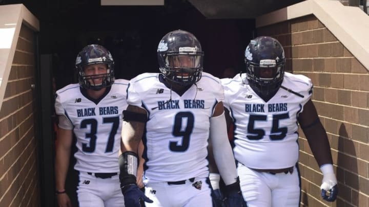 Sep 5, 2015; Boston, MA, USA; Maine Black Bears place kicker Sean Decloux (37), defensive end Trevor Bates (9), and offensive lineman Bruce Johnson (55) walk onto the field prior to their game against the Boston College Eagles at Alumni Stadium. Mandatory Credit: Bob DeChiara-USA TODAY Sports